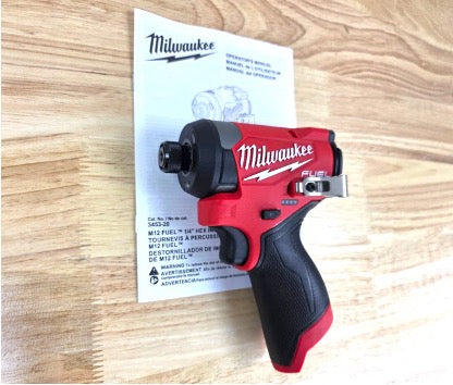 Milwaukee (M12 FUEL 12V Lithium-Ion Brushless Cordless 1/4 in. Hex Impact Driver on a table